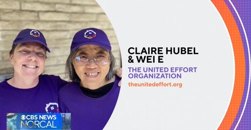 Claire and Wei smile while wearing United Effort branded hats and shirts.